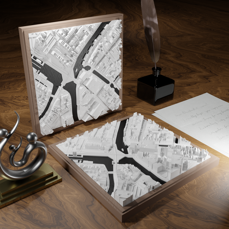 3D-geprinte miniatuur van Gouda stad, beschikbaar in 20 verschillende versies, met gedetailleerde weergave. Verkrijgbaar in een stijlvolle plexiglas kubus of in een ophangbaar frame. Perfect als handgemaakte decoratie voor liefhebbers van Gouda, met keuze tussen een ingelijst ontwerp of een moderne plexi cube.