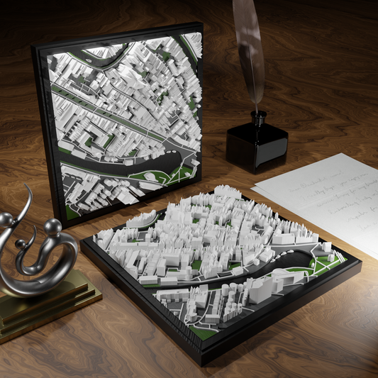 3D-geprinte miniatuur van Gouda stad, beschikbaar in 20 verschillende versies, met gedetailleerde weergave. Verkrijgbaar in een stijlvolle plexiglas kubus of in een ophangbaar frame. Perfect als handgemaakte decoratie voor liefhebbers van Gouda, met keuze tussen een ingelijst ontwerp of een moderne plexi cube.